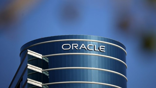 Oracle stock rises on upbeat outlook, while Apple shares slip and other stocks on the move