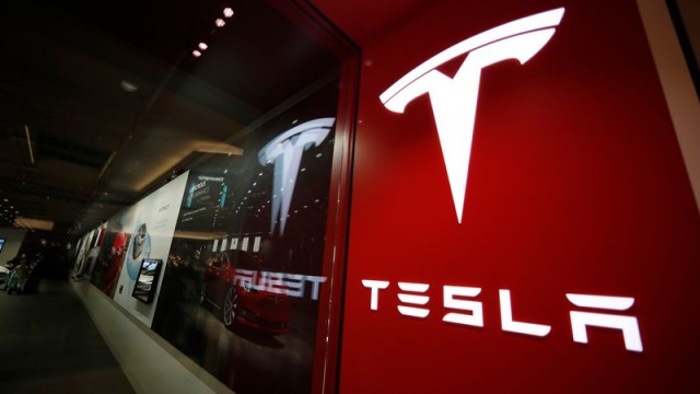 Tesla's stock slide rattles carmakers; IBM, Las Vegas Sands shares rise, and more big movers